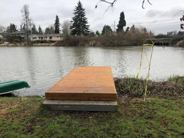 Timber dock Andy built on a pond bank